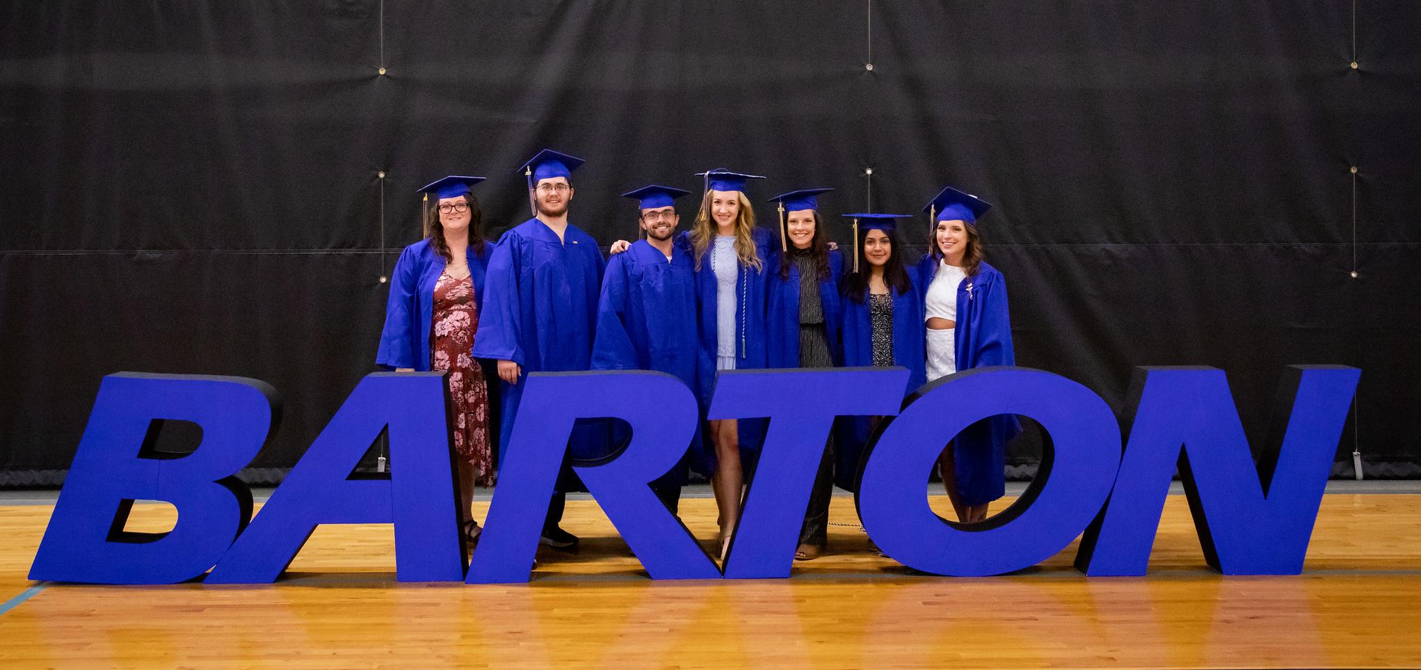 Graduates pose after commencement ceremony